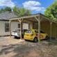 wooden carport with white and yellow cars