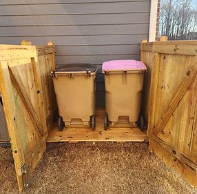 trash containers with fence