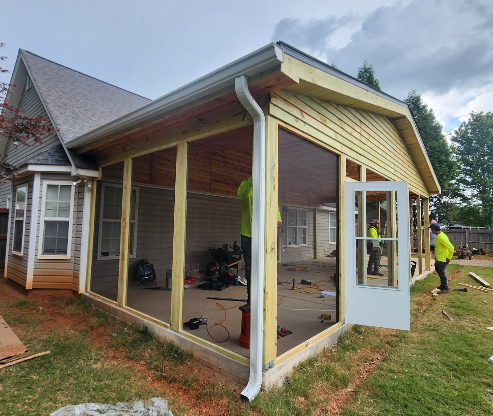 custom built screened in porch over concrete, gable style screened in porch on ranch home in Buford, Georgia