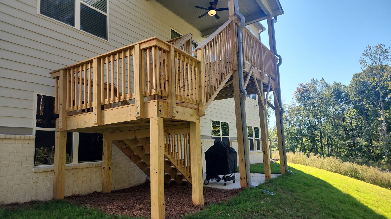 custom wood deck stairs with landing in the middle in Flowery Branch, Georgia